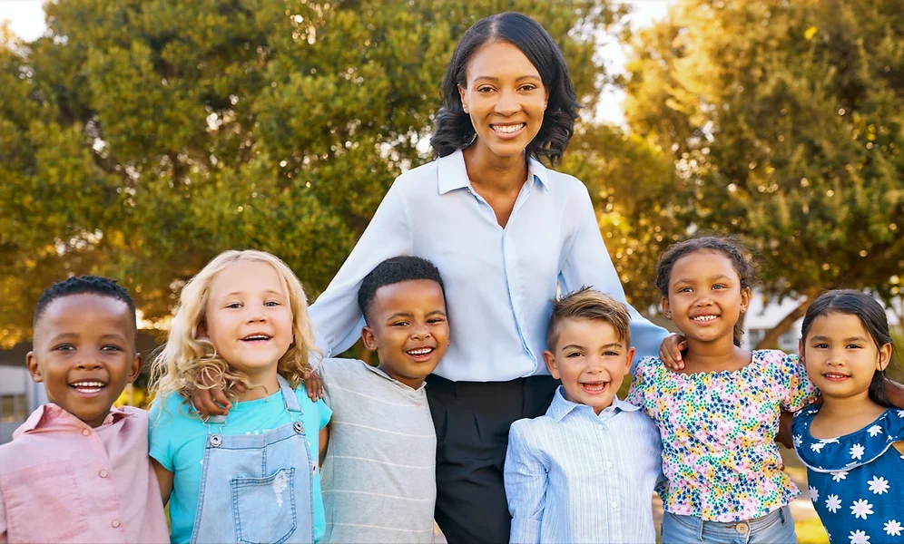 A primary school teacher with her students